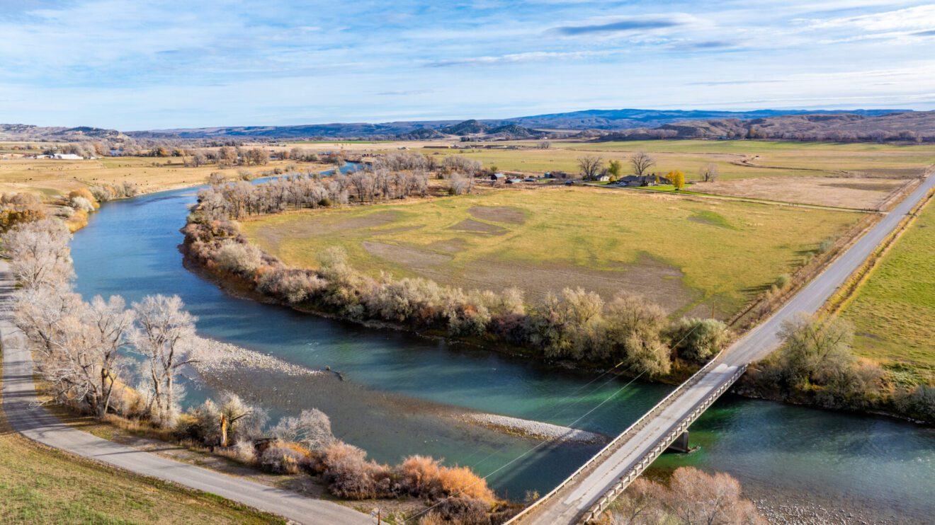 Aerial view of the river bend and bridge crossing Alpenglow Ranch near Bridger, Montana
